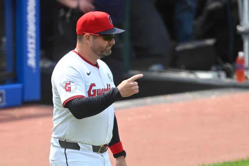 Jun 1, 2025; Cleveland, Ohio, USA; Cleveland Guardians manager Stephen Vogt (12) makes a call to the bullpen in the seventh inning against the Los Angeles Angels at Progressive Field. Mandatory Credit: David Richard-Imagn Images