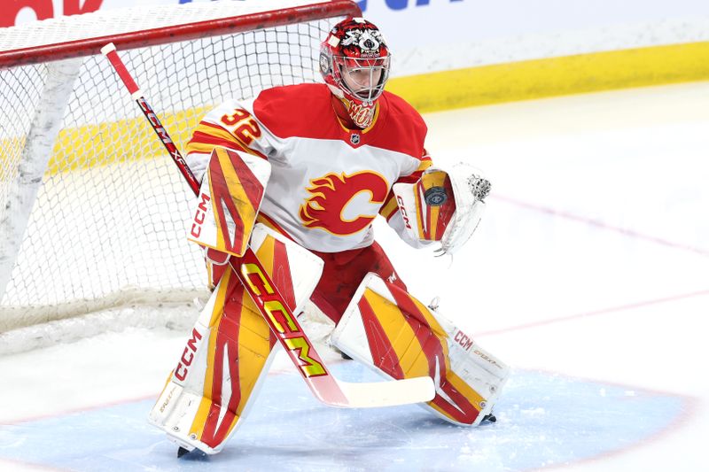 Jan 18, 2025; Winnipeg, Manitoba, CAN; Calgary Flames goaltender Dustin Wolf (32) warms up before a game against the Winnipeg Jets at Canada Life Centre. Mandatory Credit: James Carey Lauder-Imagn Images