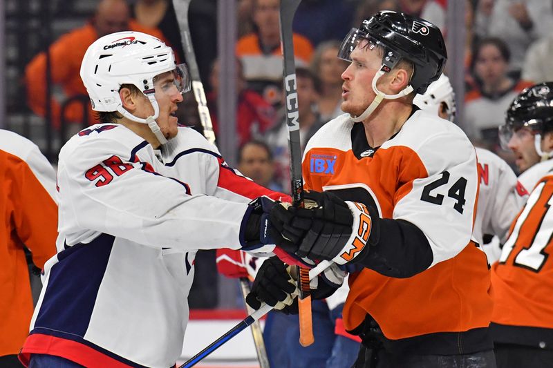 Apr 16, 2024; Philadelphia, Pennsylvania, USA; Washington Capitals right wing Nicolas Aube-Kubel (96) and Philadelphia Flyers defenseman Nick Seeler (24) battle during the third period at Wells Fargo Center. Mandatory Credit: Eric Hartline-USA TODAY Sports