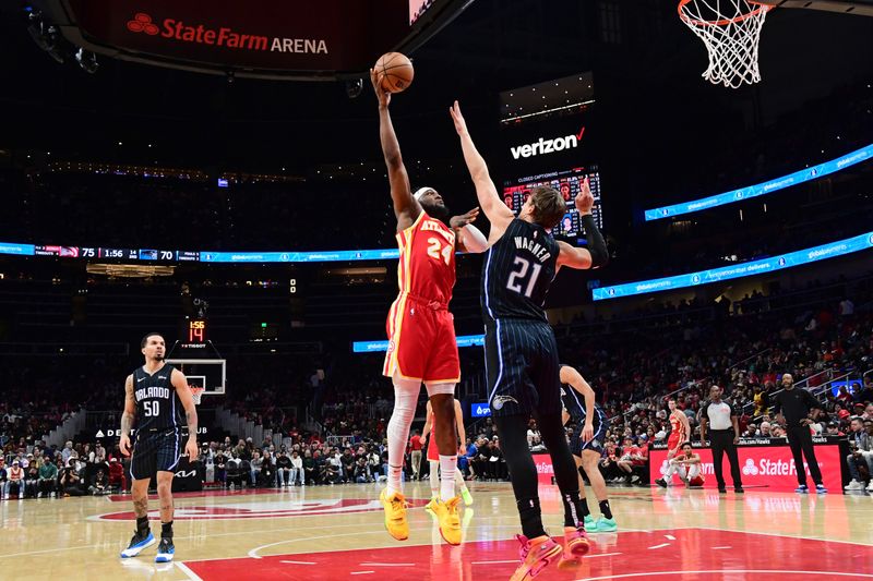 ATLANTA, GA - FEBRUARY 25: Bruno Fernando #24 of the Atlanta Hawks shoots the ball during the game against the Orlando Magic on February 25, 2024 at State Farm Arena in Atlanta, Georgia.  NOTE TO USER: User expressly acknowledges and agrees that, by downloading and/or using this Photograph, user is consenting to the terms and conditions of the Getty Images License Agreement. Mandatory Copyright Notice: Copyright 2024 NBAE (Photo by Scott Cunningham/NBAE via Getty Images)