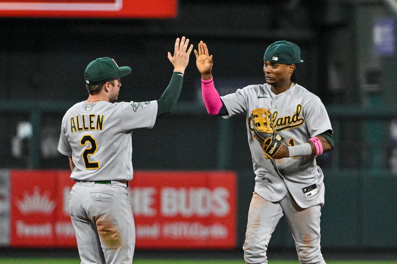 Aug 16, 2023; St. Louis, Missouri, USA;  Oakland Athletics shortstop Nick Allen (2) and center fielder Esteury Ruiz (1) celebrate after the Athletics defeated the St. Louis Cardinals at Busch Stadium. Mandatory Credit: Jeff Curry-USA TODAY Sports