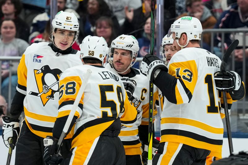 Nov 28, 2025; Columbus, Ohio, USA;  Pittsburgh Penguins center Sidney Crosby (87) celebrates with teammates after scoring a goal against the Columbus Blue Jackets in the first period at Nationwide Arena. Mandatory Credit: Aaron Doster-Imagn Images
