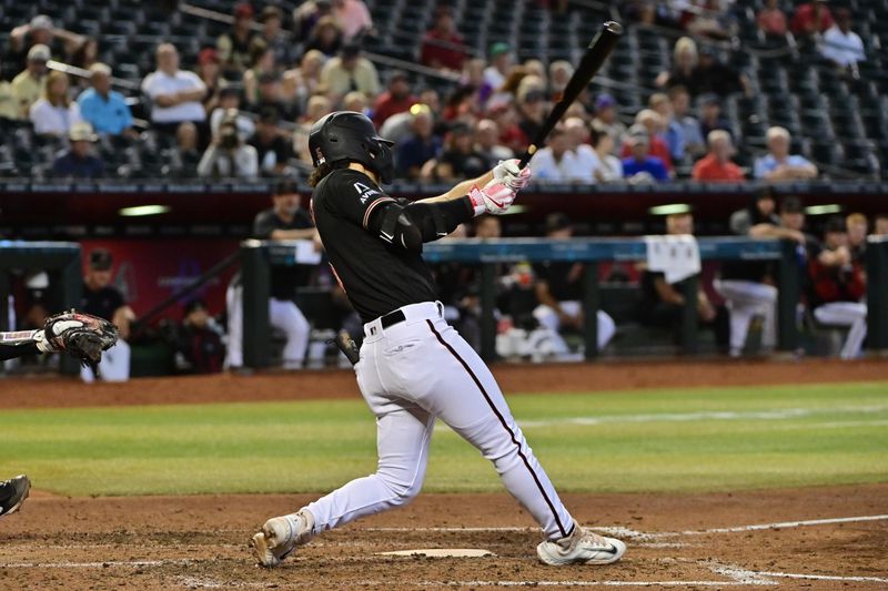 Sep 6, 2023; Phoenix, Arizona, USA; Arizona Diamondbacks center fielder Alek Thomas (5) hits a two RBI single in the fourth inning against the Colorado Rockies at Chase Field. Mandatory Credit: Matt Kartozian-USA TODAY Sports
