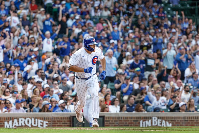 May 5, 2023; Chicago, Illinois, USA; Chicago Cubs first baseman Matt Mervis (22) watches his RBI-single against the Miami Marlins during the eight inning at Wrigley Field. Mandatory Credit: Kamil Krzaczynski-USA TODAY Sports