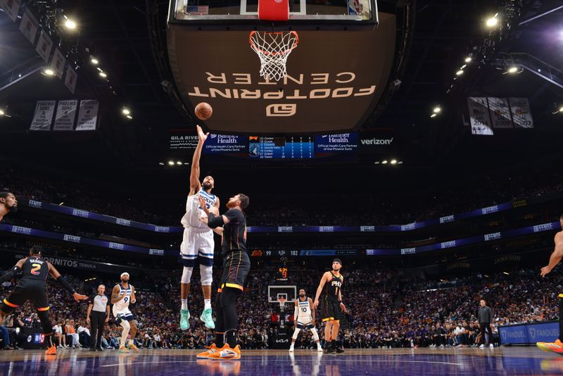 PHOENIX, AZ - APRIL 4: Rudy Gobert #27 of the Minnesota Timberwolves shoots the ball during the game against the Phoenix Suns during Round 1 Game 4 of the 2024 NBA Playoffs on April 4, 2023 at Footprint Center in Phoenix, Arizona. NOTE TO USER: User expressly acknowledges and agrees that, by downloading and or using this photograph, user is consenting to the terms and conditions of the Getty Images License Agreement. Mandatory Copyright Notice: Copyright 2024 NBAE (Photo by Barry Gossage/NBAE via Getty Images)