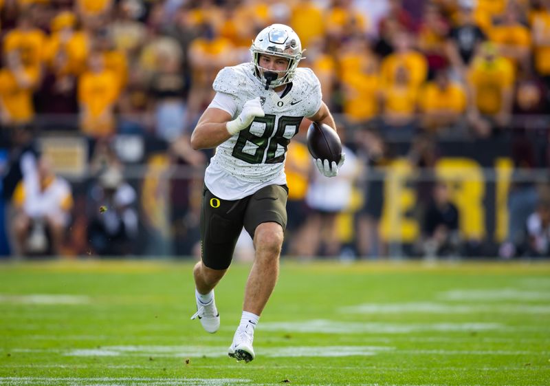 Nov 18, 2023; Tempe, Arizona, USA; Oregon Ducks tight end Patrick Herbert (88) scores a touchdown against the Arizona State Sun Devils in the first half at Mountain America Stadium. Mandatory Credit: Mark J. Rebilas-USA TODAY Sports