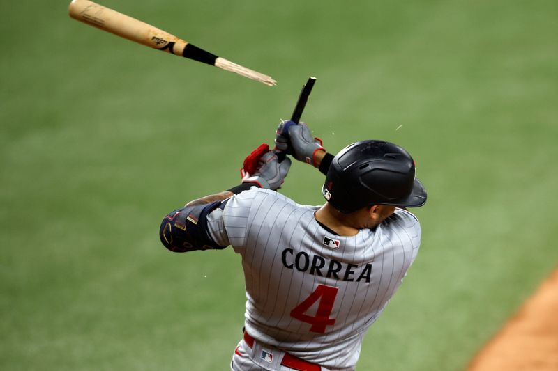 Sep 2, 2023; Arlington, Texas, USA; Minnesota Twins shortstop Carlos Correa (4) breaks his bat in the seventh inning against the Texas Rangers at Globe Life Field. Mandatory Credit: Tim Heitman-USA TODAY Sports