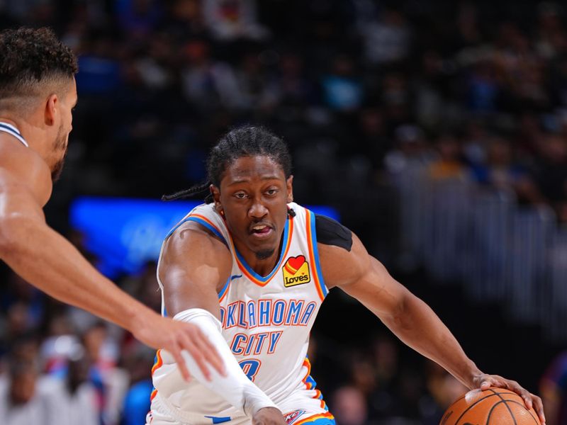 DENVER, CO - NOVEMBER 6: Jalen Williams #8 of the Oklahoma City Thunder dribbles the ball during the game against the Denver Nuggets on November 6, 2024 at Ball Arena in Denver, Colorado. NOTE TO USER: User expressly acknowledges and agrees that, by downloading and/or using this Photograph, user is consenting to the terms and conditions of the Getty Images License Agreement. Mandatory Copyright Notice: Copyright 2024 NBAE (Photo by Garrett Ellwood/NBAE via Getty Images)