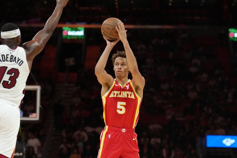 MIAMI, FL - OCTOBER 16: Dyson Daniels #5 of the Atlanta Hawks shoots the ball during the game against the Miami Heat during a preseason game on October 16, 2024 at Kaseya Center in Miami, Florida. NOTE TO USER: User expressly acknowledges and agrees that, by downloading and or using this Photograph, user is consenting to the terms and conditions of the Getty Images License Agreement. Mandatory Copyright Notice: Copyright 2024 NBAE (Photo by Eric Espada/NBAE via Getty Images)