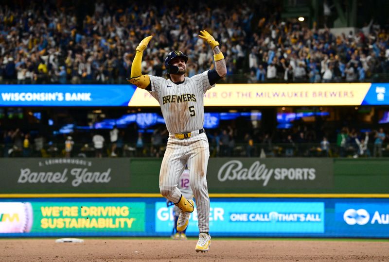 Oct 2, 2024; Milwaukee, Wisconsin, USA; Milwaukee Brewers outfielder Garrett Mitchell (5) celebrates after hitting a two-run home run during the eighth inning in game two of the Wildcard round for the 2024 MLB Playoffs against the New York Mets at American Family Field. Mandatory Credit: Benny Sieu-Imagn Images
