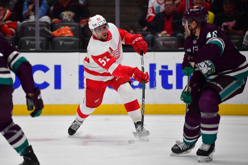 Jan 7, 2024; Anaheim, California, USA; Detroit Red Wings left wing David Perron (57) shoots on goal against the Anaheim Ducks during the third period at Honda Center. Mandatory Credit: Gary A. Vasquez-USA TODAY Sports