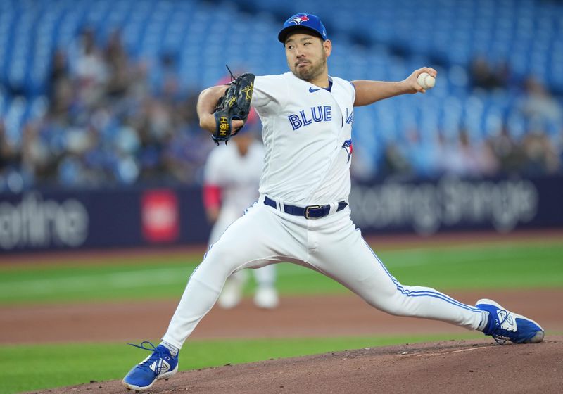 Sep 13, 2023; Toronto, Ontario, CAN; Toronto Blue Jays starting pitcher Yusei Kikuchi (16) throws a pitch against the Texas Rangers during the first inning at Rogers Centre. Mandatory Credit: Nick Turchiaro-USA TODAY Sports