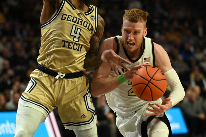 Feb 11, 2023; Winston-Salem, North Carolina, USA; Wake Forest Demon Deacons guard Cameron Hildreth (2) drives to the basket past Georgia Tech Yellow Jackets forward Javon Franklin (4) during the first half at Lawrence Joel Veterans Memorial Coliseum. Mandatory Credit: William Howard-USA TODAY Sports