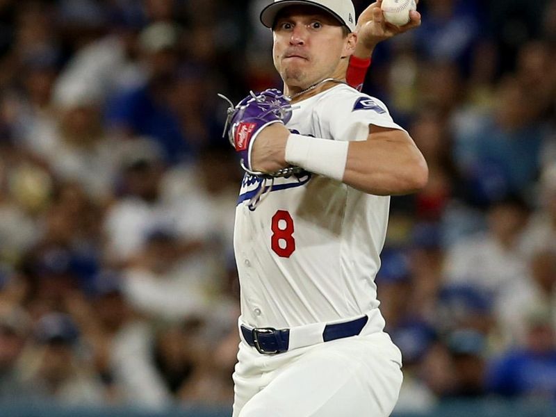 Jul 4, 2024; Los Angeles, California, USA; Los Angeles Dodgers third baseman Enrique Hernandez (8) throws to first for an out during the eighth inning against the Arizona Diamondbacks at Dodger Stadium. Mandatory Credit: Jason Parkhurst-USA TODAY Sports