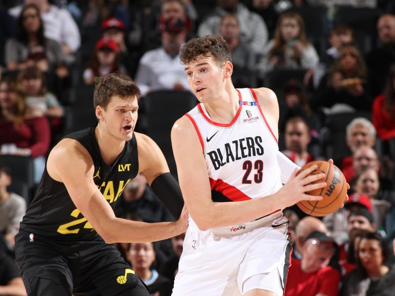 PORTLAND, OR - OCTOBER 18: Donovan Clingan #23 of the Portland Trail Blazers handles the ball during the game against the Utah Jazz on October 18, 2024 at the Moda Center Arena in Portland, Oregon. NOTE TO USER: User expressly acknowledges and agrees that, by downloading and or using this photograph, user is consenting to the terms and conditions of the Getty Images License Agreement. Mandatory Copyright Notice: Copyright 2024 NBAE (Photo by Cameron Browne/NBAE via Getty Images)