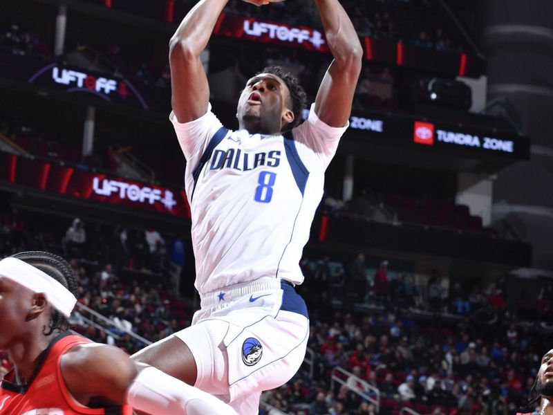 HOUSTON, TX - JANUARY 01   Olivier Maxence-Prosper #8 of the Dallas Mavericks shoots the ball during the game against the Houston Rockets on January 01, 2025 at the Toyota Center in Houston, Texas. NOTE TO USER: User expressly acknowledges and agrees that, by downloading and or using this photograph, User is consenting to the terms and conditions of the Getty Images License Agreement. Mandatory Copyright Notice: Copyright 2025 NBAE (Photo by Logan Riely/NBAE via Getty Images)