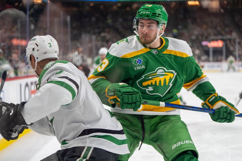 Nov 16, 2024; Saint Paul, Minnesota, USA; Minnesota Wild center Yakov Trenin (13) checks Dallas Stars defenseman Mathew Dumba (3) in the first period at Xcel Energy Center. Mandatory Credit: Matt Blewett-Imagn Images