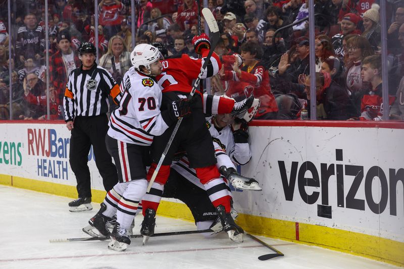 Jan 5, 2024; Newark, New Jersey, USA; Members of the New Jersey Devils and Chicago Blackhawks fight during the first period at Prudential Center. Mandatory Credit: Ed Mulholland-USA TODAY Sports