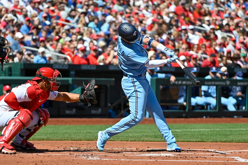 Apr 2, 2023; St. Louis, Missouri, USA;  Toronto Blue Jays left fielder Whit Merrifield (15) hits a one run sacrifice fly against the St. Louis Cardinals during the second inning at Busch Stadium. Mandatory Credit: Jeff Curry-USA TODAY Sports