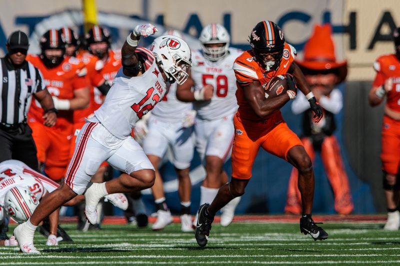 Sep 21, 2024; Stillwater, Oklahoma, USA; Utah Utes linebacker Sione Fotu (12) chases Oklahoma State Cowboys running back Sesi Vailahi (3) during the third quarter at Boone Pickens Stadium. Mandatory Credit: William Purnell-Imagn Images