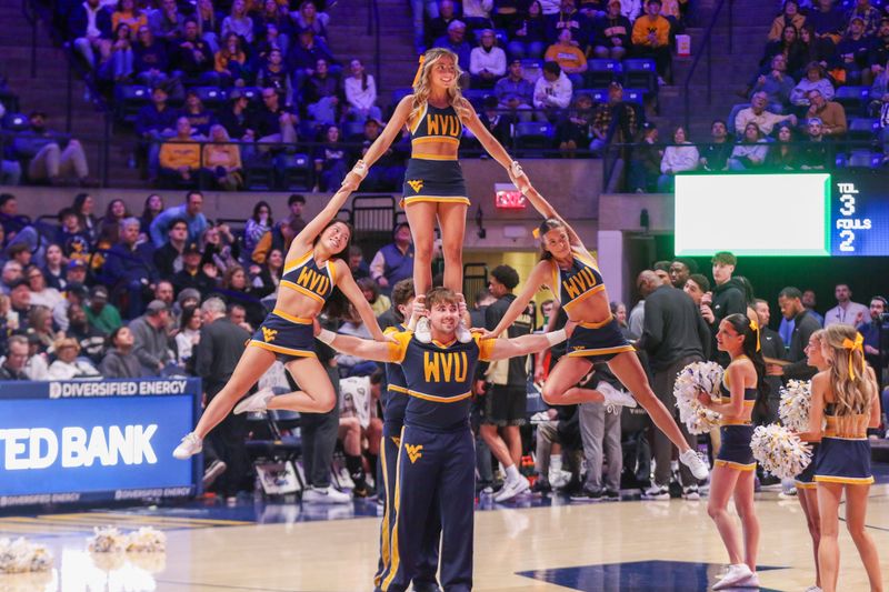 Jan 17, 2026; Morgantown, West Virginia, USA; West Virginia Mountaineers cheerleaders perform during the second half against the Colorado Buffaloes at Hope Coliseum. Mandatory Credit: Ben Queen-Imagn Images