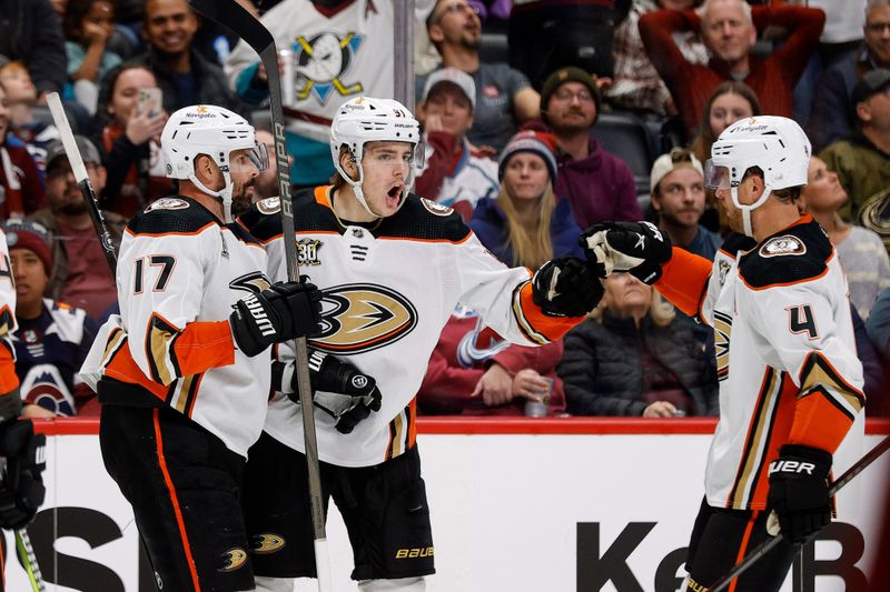 Dec 5, 2023; Denver, Colorado, USA; Anaheim Ducks center Leo Carlsson (91) celebrates his goal with left wing Alex Killorn (17) and defenseman Cam Fowler (4) in the third period against the Colorado Avalanche at Ball Arena. Mandatory Credit: Isaiah J. Downing-USA TODAY Sports