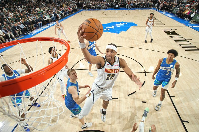 MILWAUKEE, WI - FEBRUARY 12: Zeke Nnaji #22 of the Denver Nuggets drives to the basket during the game against the Milwaukee Bucks on February 12, 2024 at the Fiserv Forum Center in Milwaukee, Wisconsin. NOTE TO USER: User expressly acknowledges and agrees that, by downloading and or using this Photograph, user is consenting to the terms and conditions of the Getty Images License Agreement. Mandatory Copyright Notice: Copyright 2024 NBAE (Photo by Gary Dineen/NBAE via Getty Images).