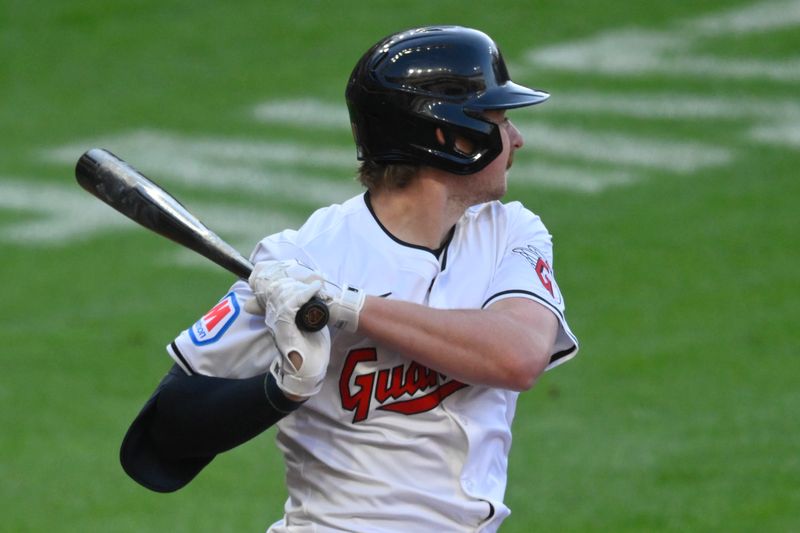 May 18, 2024; Cleveland, Ohio, USA; Cleveland Guardians designated hitter Kyle Manzardo (9) hits an RBI double in the fifth inning against the Minnesota Twins at Progressive Field. Mandatory Credit: David Richard-USA TODAY Sports