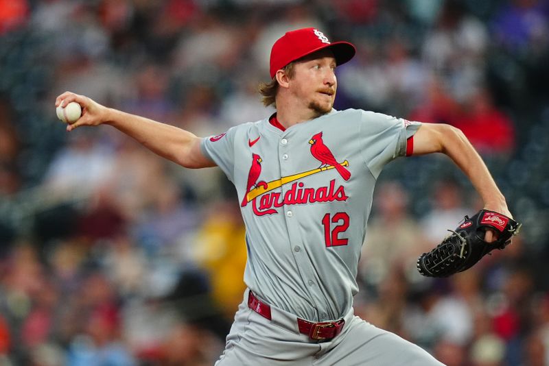 Sep 25, 2024; Denver, Colorado, USA; St. Louis Cardinals starting pitcher Erick Fedde (12) delivers a pitch in the first inning against the Colorado Rockies at Coors Field. Mandatory Credit: Ron Chenoy-Imagn Images