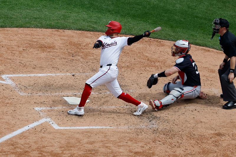 May 22, 2024; Washington, District of Columbia, USA; Washington Nationals second base Ildemaro Vargas (14) doubles against the Minnesota Twins during the seventh inning at Nationals Park. Mandatory Credit: Geoff Burke-USA TODAY Sports