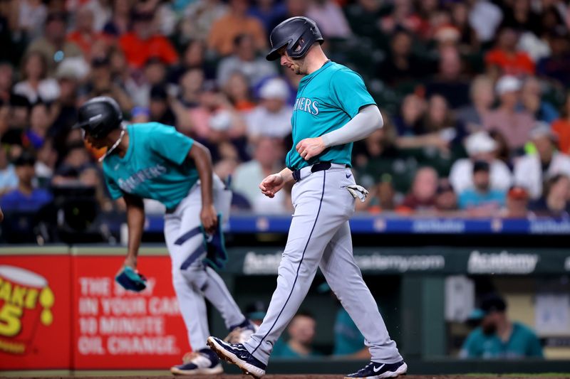 May 5, 2024; Houston, Texas, USA; Seattle Mariners designated hitter Mitch Garver (18) crosses home plate to score a run against the Houston Astros during the second inning at Minute Maid Park. Mandatory Credit: Erik Williams-USA TODAY Sports