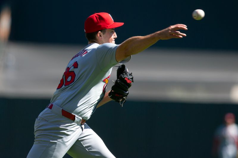 Sep 29, 2024; San Francisco, California, USA; St. Louis Cardinals starting pitcher Michael McGreevy (36) throws out San Francisco Giants first baseman LaMonte Wade Jr. at first base during the first inning at Oracle Park. Mandatory Credit: D. Ross Cameron-Imagn Images