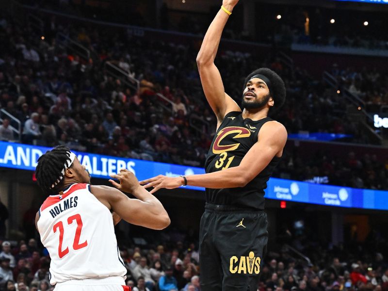 CLEVELAND, OHIO - DECEMBER 03: Jarrett Allen #31 of the Cleveland Cavaliers shoots over Richaun Holmes #22 of the Washington Wizards during the third quarter at Rocket Mortgage Fieldhouse on December 03, 2024 in Cleveland, Ohio. The Cavaliers defeated the Wizards 118-87. NOTE TO USER: User expressly acknowledges and agrees that, by downloading and or using this photograph, User is consenting to the terms and conditions of the Getty Images License Agreement. (Photo by Jason Miller/Getty Images)