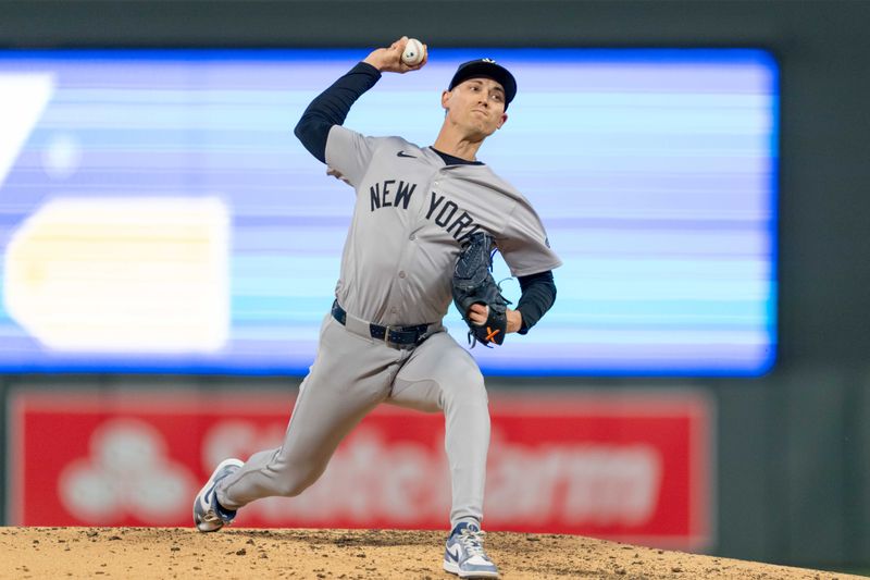 May 15, 2024; Minneapolis, Minnesota, USA; New York Yankees pitcher Luke Weaver (30) pitches in the seventh inning against the Minnesota Twins at Target Field. Mandatory Credit: Matt Blewett-USA TODAY Sports