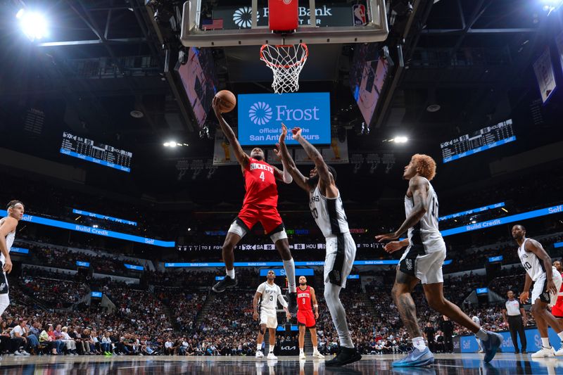 SAN ANTONIO, TX - OCTOBER 26: Jalen Green #4 of the Houston Rockets drives to the basket during the game against the San Antonio Spurs on October 26, 2024 at the Frost Bank Center in San Antonio, Texas. NOTE TO USER: User expressly acknowledges and agrees that, by downloading and or using this photograph, user is consenting to the terms and conditions of the Getty Images License Agreement. Mandatory Copyright Notice: Copyright 2024 NBAE (Photos by Michael Gonzales/NBAE via Getty Images)