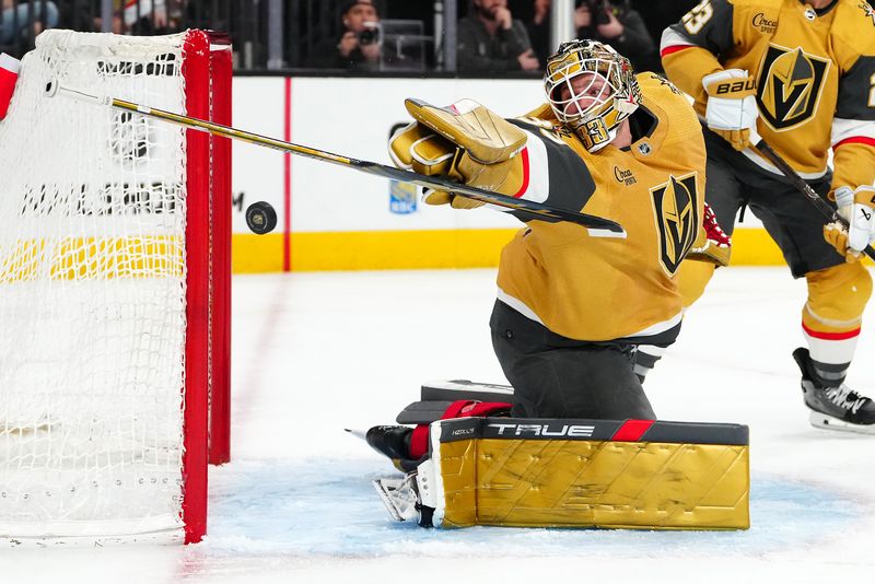 Feb 12, 2024; Las Vegas, Nevada, USA; Vegas Golden Knights goaltender Adin Hill (33) loses his stick after making a save against the Minnesota Wild during the second period at T-Mobile Arena. Mandatory Credit: Stephen R. Sylvanie-USA TODAY Sports