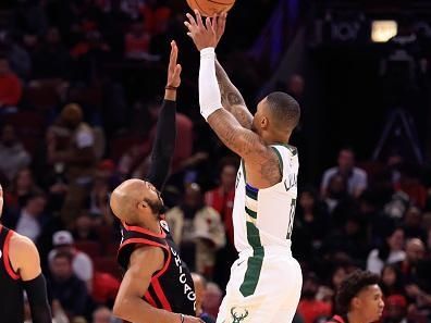 CHICAGO, ILLINOIS - NOVEMBER 30: Damian Lillard #0 of the Milwaukee Bucks takes a shot in the game against the Chicago Bulls at the United Center on November 30, 2023 in Chicago, Illinois. NOTE TO USER: User expressly acknowledges and agrees that, by downloading and or using this photograph, User is consenting to the terms and conditions of the Getty Images License Agreement. (Photo by Justin Casterline/Getty Images)