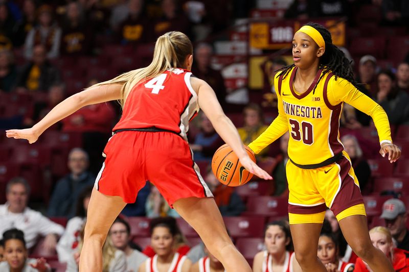 Feb 8, 2024; Minneapolis, Minnesota, USA; Minnesota Golden Gophers guard Janay Sanders (30) dribbles as Ohio State Buckeyes guard Jacy Sheldon (4) defends during the first half at Williams Arena. Mandatory Credit: Matt Krohn-USA TODAY Sports