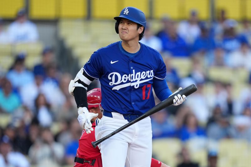 Mar 23, 2025; Los Angeles, California, USA; Los Angeles Dodgers two-way player Shohei Ohtani (17) reacts in the first inning against the Los Angeles Angels at Dodger Stadium. Mandatory Credit: Kirby Lee-Imagn Images