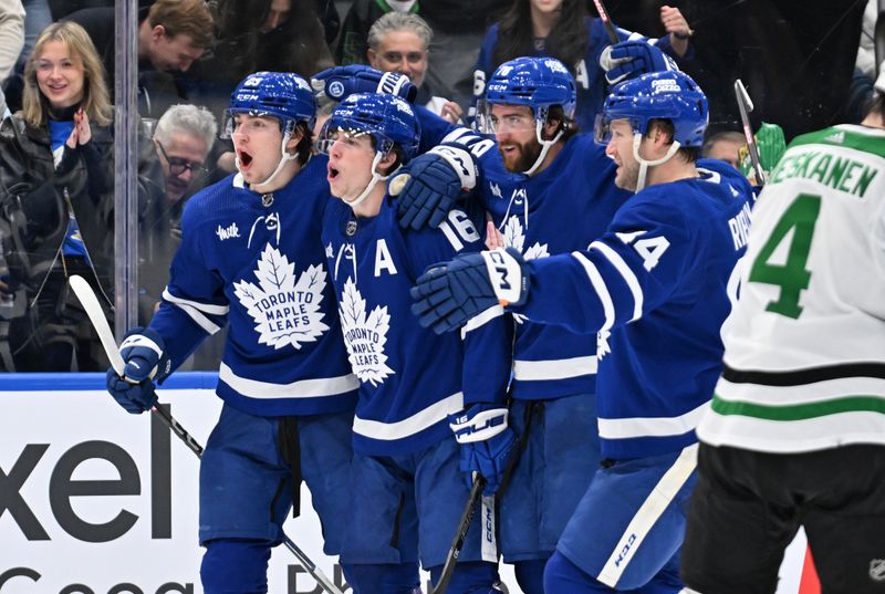 Feb 7, 2024; Toronto, Ontario, CAN; Toronto Maple Leafs forward Mitchell Marner (16) celebrates with team mates after scoring against the Dallas Stars in the third period at Scotiabank Arena. Mandatory Credit: Dan Hamilton-USA TODAY Sports