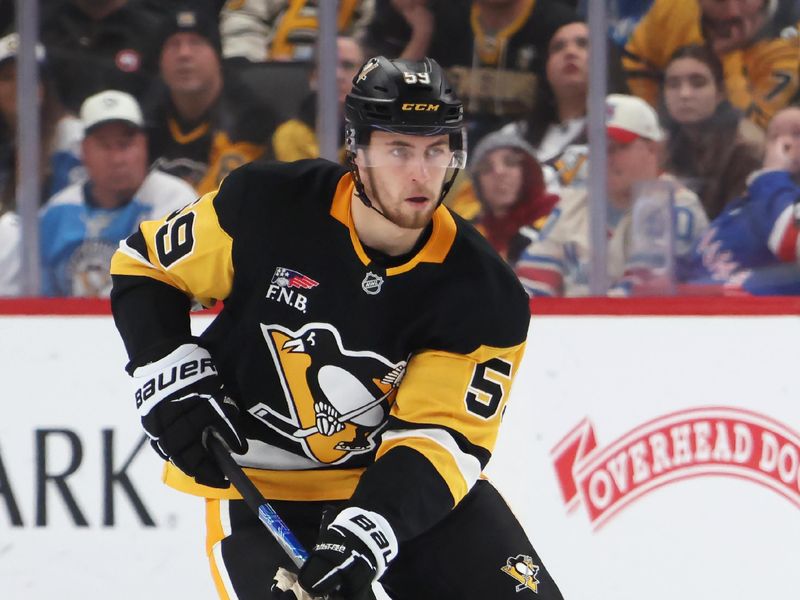 Jan 31, 2026; Pittsburgh, Pennsylvania, USA;  Pittsburgh Penguins right wing Egor Chinakhov (59) skates up ice with the puck against the New York Rangers during the third period at PPG Paints Arena. Mandatory Credit: Charles LeClaire-Imagn Images