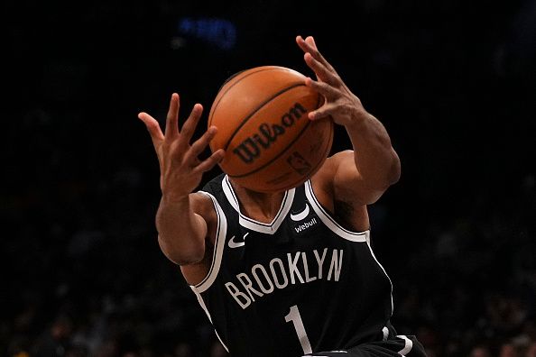 NEW YORK, NEW YORK - DECEMBER 23: Mikal Bridges #1 of the Brooklyn Nets reaches for the ball against the Detroit Pistons in the second half at Barclays Center on December 23, 2023 in the Brooklyn borough of New York City. The Nets defeated the Pistons 126-115. NOTE TO USER: User expressly acknowledges and agrees that, by downloading and or using this photograph, User is consenting to the terms and conditions of the Getty Images License Agreement. (Photo by Mitchell Leff/Getty Images)