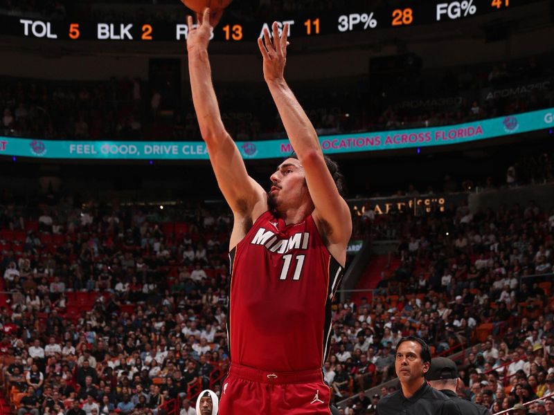 MIAMI, FL - MARCH 10: Jaime Jaquez Jr. #11 of the Miami Heat three point basket during the game against the Washington Wizards on March 10, 2024 at Kaseya Center in Miami, Florida. NOTE TO USER: User expressly acknowledges and agrees that, by downloading and or using this Photograph, user is consenting to the terms and conditions of the Getty Images License Agreement. Mandatory Copyright Notice: Copyright 2024 NBAE (Photo by Issac Baldizon/NBAE via Getty Images)