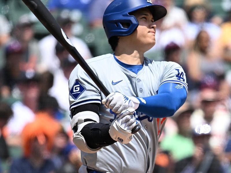 Jul 13, 2024; Detroit, Michigan, USA; Los Angeles Dodgers designated hitter Shohei Ohtani (17) hits a solo home run against the  Detroit Tigers in the fifth inning at Comerica Park. Mandatory Credit: Lon Horwedel-USA TODAY Sports