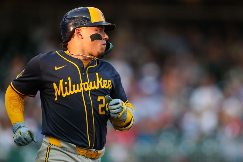 Aug 7, 2024; Atlanta, Georgia, USA; Milwaukee Brewers catcher William Contreras (24) runs to first against the Atlanta Braves in the first inning at Truist Park. Mandatory Credit: Brett Davis-USA TODAY Sports