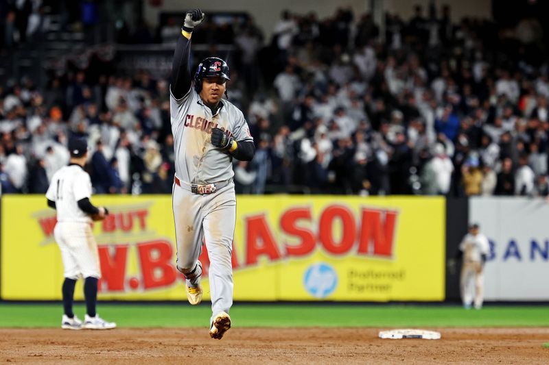 Oct 15, 2024; Bronx, New York, USA; Cleveland Guardians third base José Ramírez (11) runs the bases after hitting a two run home run during the ninth inning against the New York Yankees in game two of the ALCS for the 2024 MLB Playoffs at Yankee Stadium. Mandatory Credit: Vincent Carchietta-Imagn Images