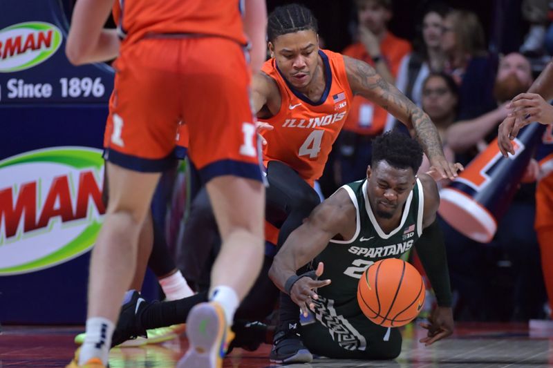 Jan 11, 2024; Champaign, Illinois, USA;  Illinois Fighting Illini guard Justin Harmon (4) and Michigan State Spartans center Mady Sissoko (22) go to the floor for a loose ball during the second half at State Farm Center. Mandatory Credit: Ron Johnson-USA TODAY Sports