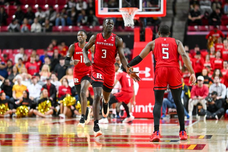 Feb 6, 2024; College Park, Maryland, USA; Rutgers Scarlet Knights forward Mawot Mag (3) celebrates with forward Aundre Hyatt (5) after scoring a basket during the second half  against the Maryland Terrapins at Xfinity Center. Mandatory Credit: Tommy Gilligan-USA TODAY Sports