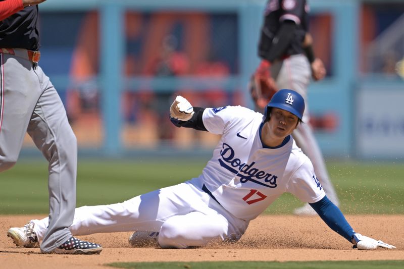 Apr 17, 2024; Los Angeles, California, USA; Los Angeles Dodgers designated hitter player Shohei Ohtani (17) steals second in the eighth inning against the Washington Nationals at Dodger Stadium. Mandatory Credit: Jayne Kamin-Oncea-USA TODAY Sports