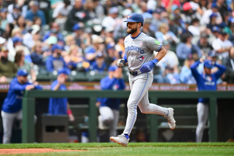 May 11, 2025; Seattle, Washington, USA; Toronto Blue Jays right fielder Nathan Lukes (38) scores a run against the Seattle Mariners during the sixth inning at T-Mobile Park. Mandatory Credit: Steven Bisig-Imagn Images
